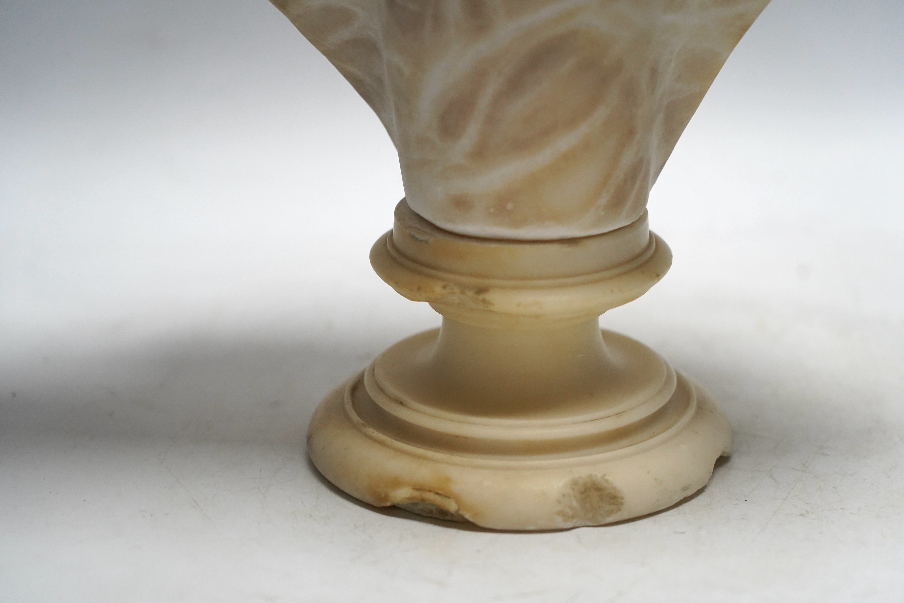 A late 19th century carved alabaster bust of a young woman, 40cm high. Condition - damaged